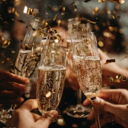 people holding glasses of champagne