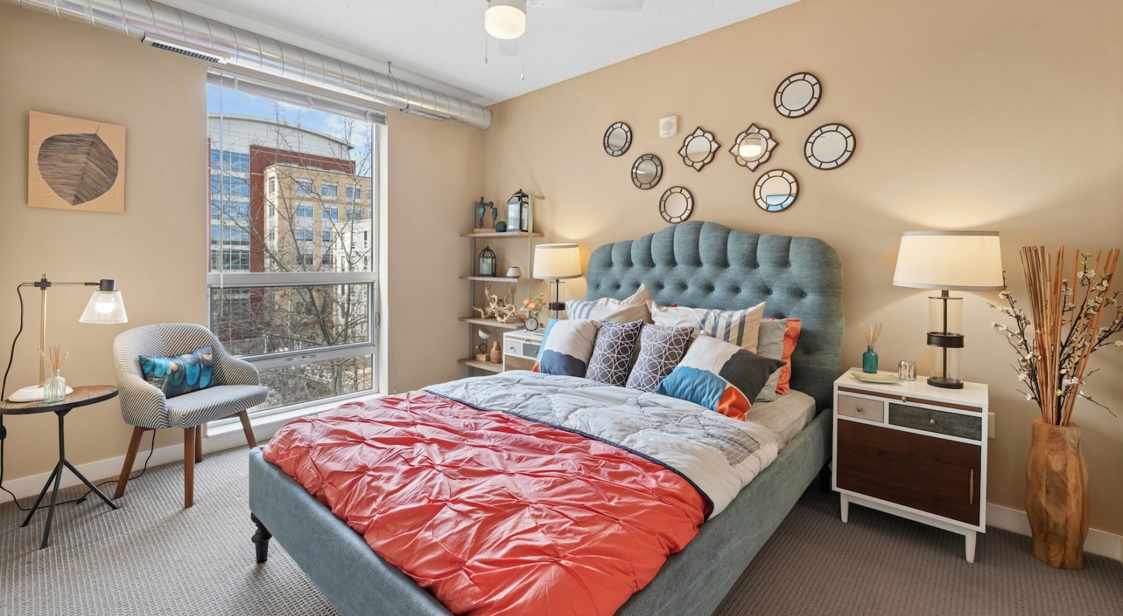a bedroom with a bed and two nightstands