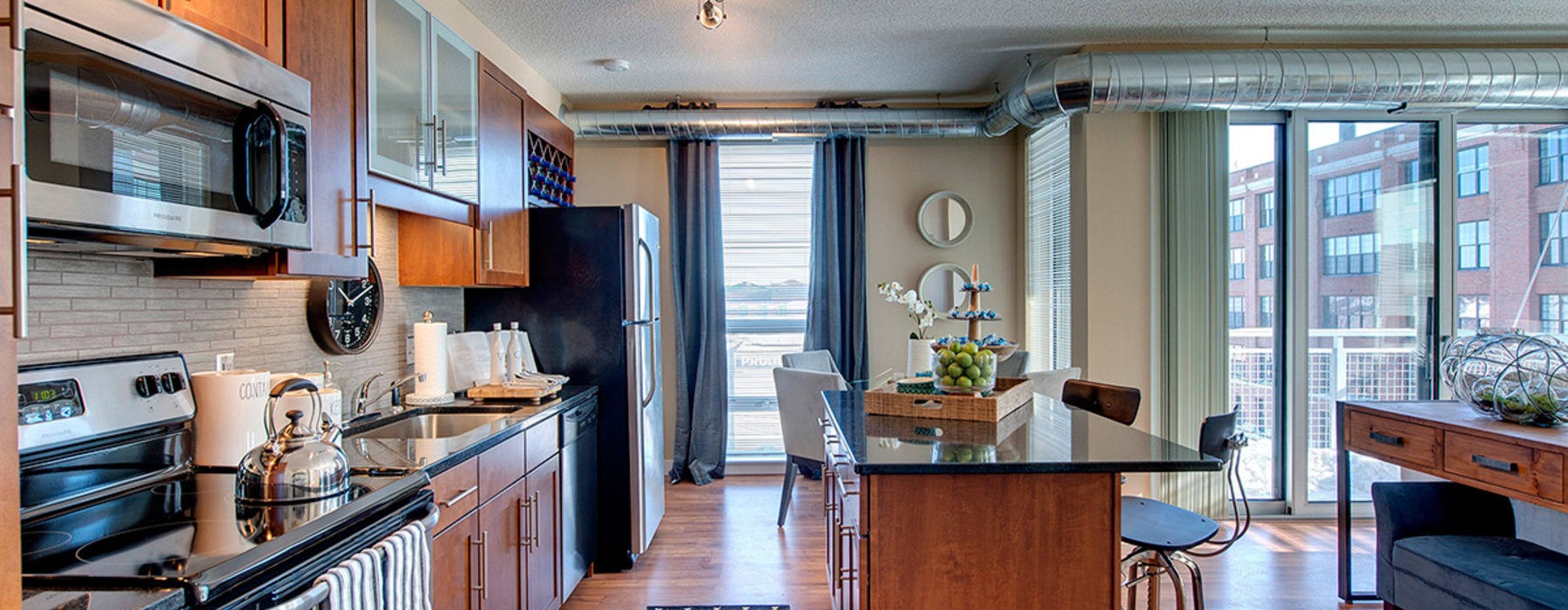 a kitchen with wood cabinets